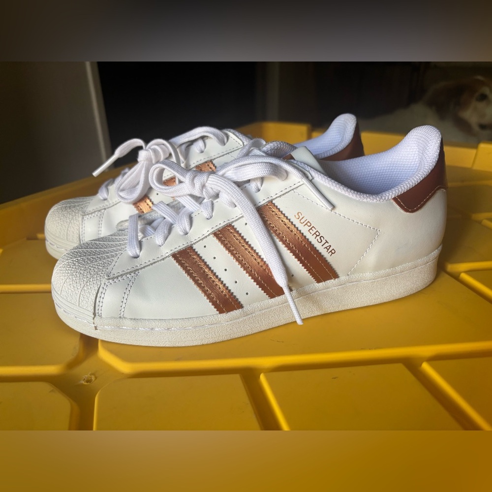 Adidas Superstar white and gold women’s sneakers